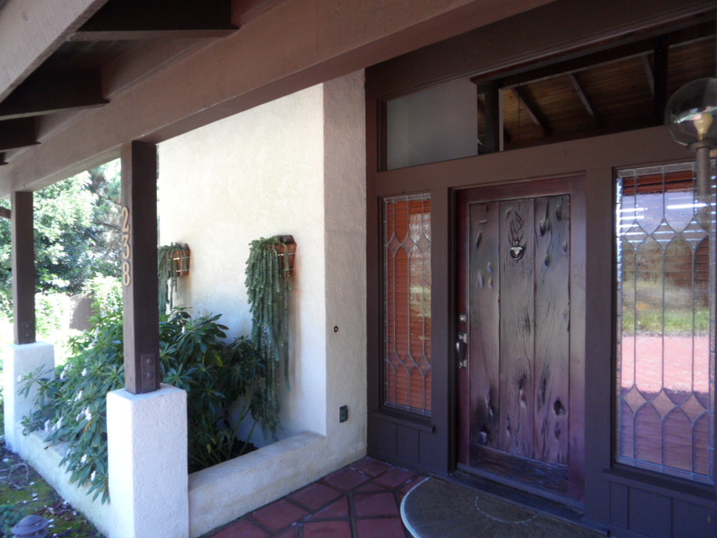238 Las Alturas Road Santa Barbara, CA 93103 - Photo 2 of 20 a view of a porch with potted plants