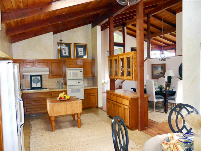 238 Las Alturas Road Santa Barbara, CA 93103 - Photo 8 of 20 a living room with furniture a rug and a chandelier