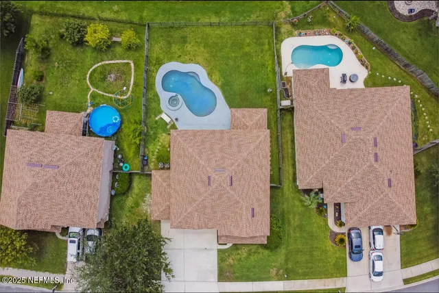 an aerial view of houses and outdoor space
