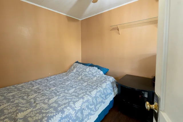 a bedroom with a bed and a table in it