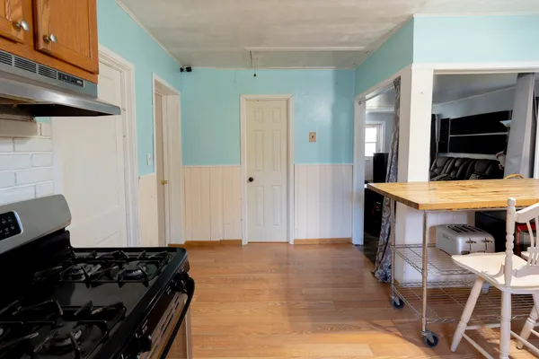 a kitchen with a table and chairs
