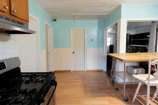 a kitchen with a table and chairs