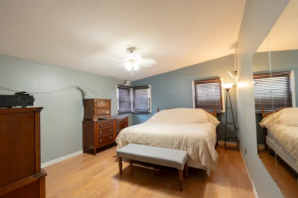 a bedroom with a bed and closet