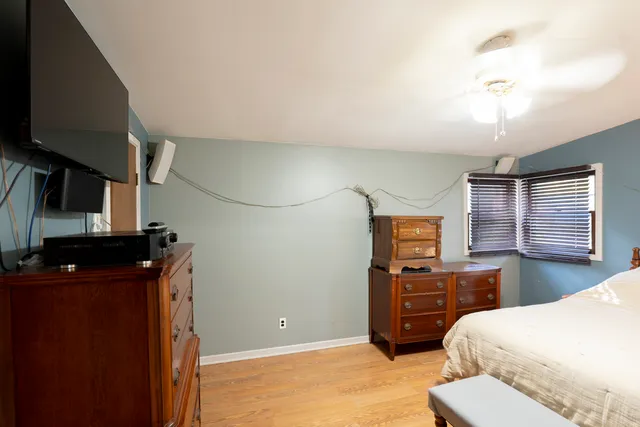 a bedroom with a bed and furniture