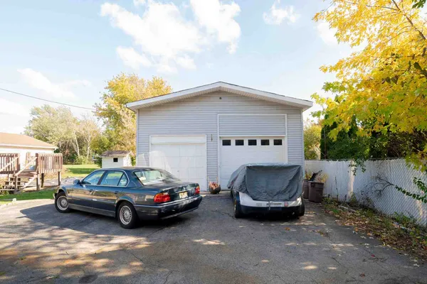 a view of a car parked in front of a house