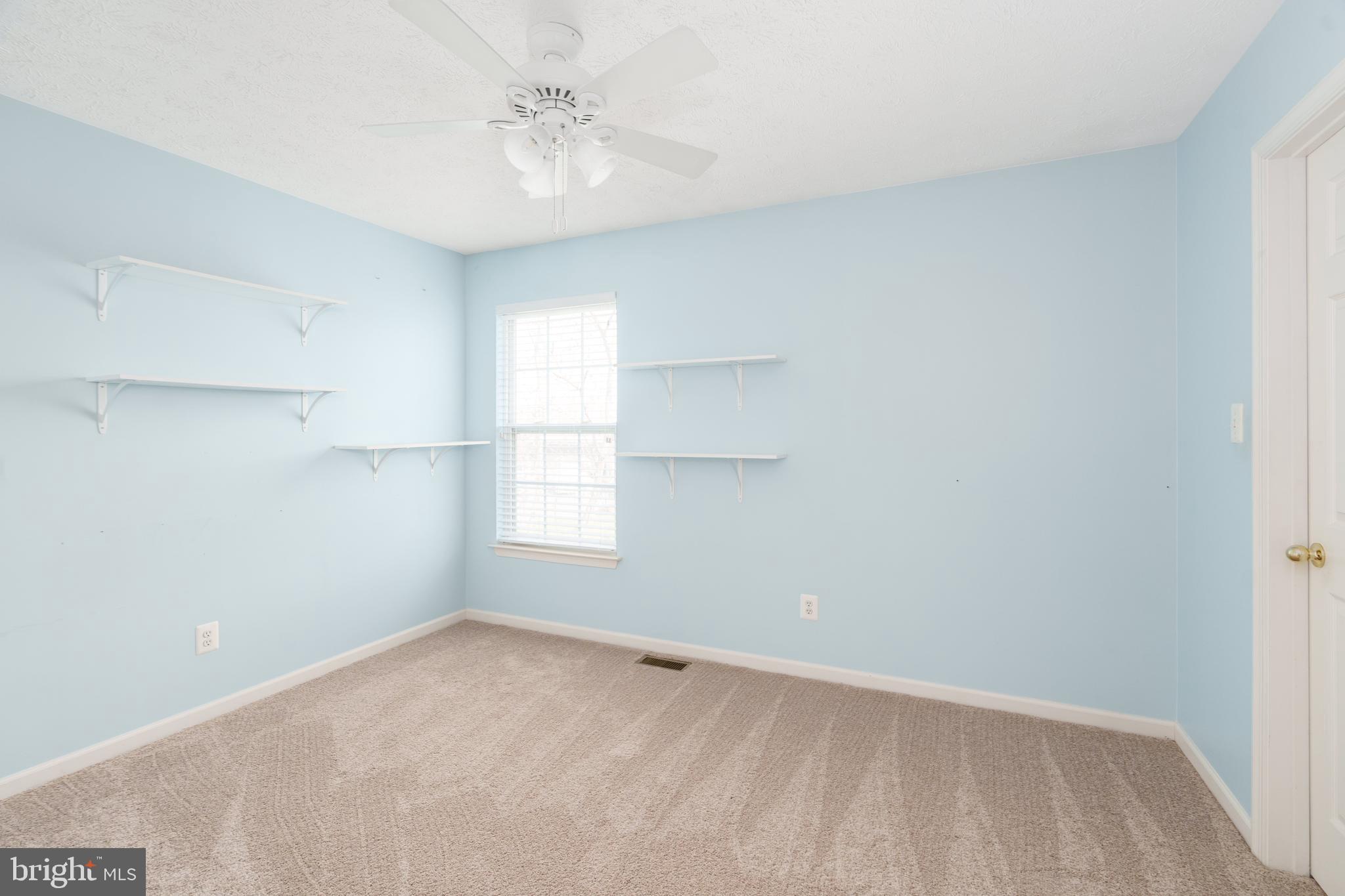 248 Patriots Way Elkton, MD 21921 - Photo 18 of 40 an empty room with windows and fan
