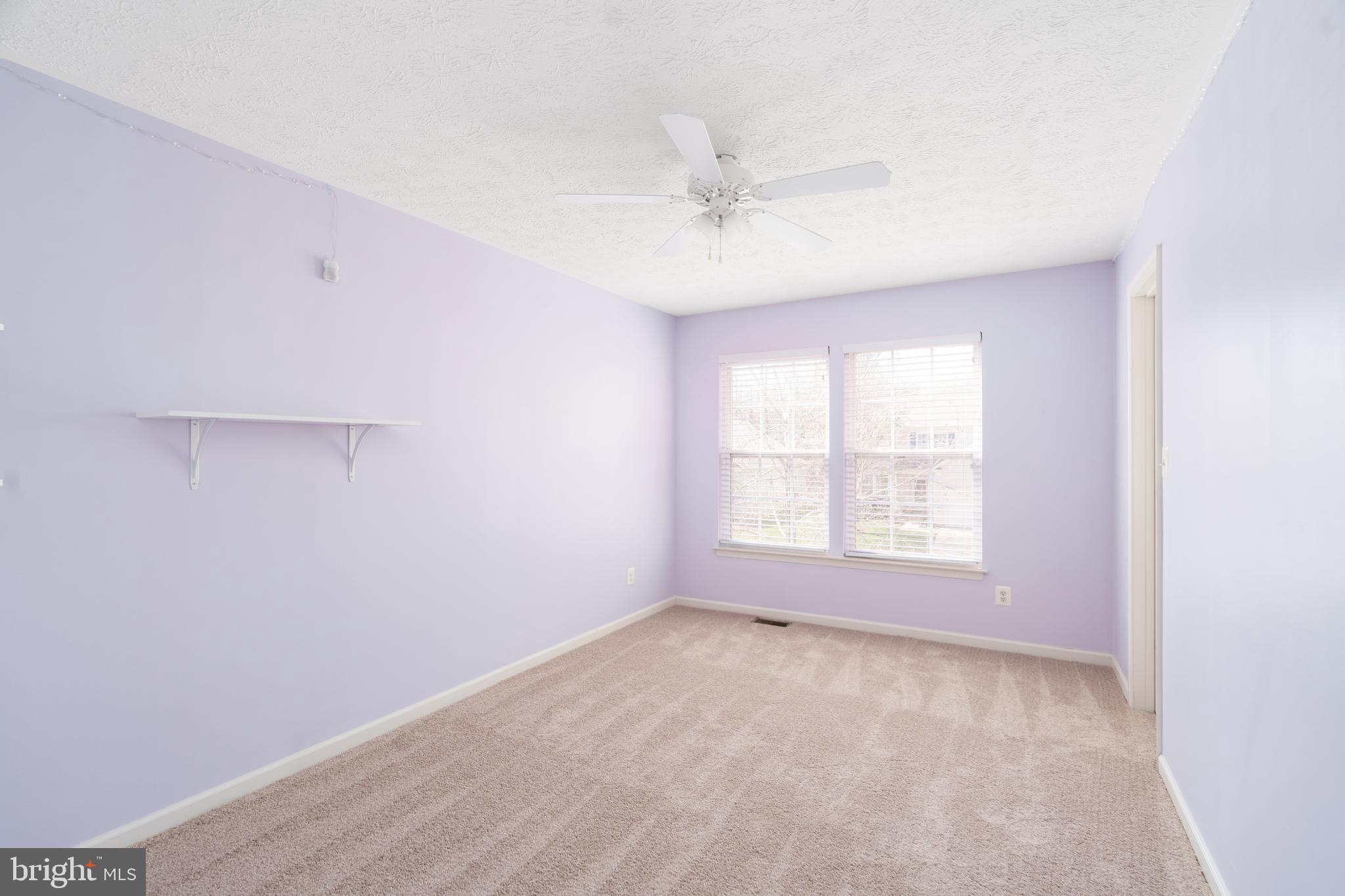 248 Patriots Way Elkton, MD 21921 - Photo 19 of 40 an empty room with a window and a fan