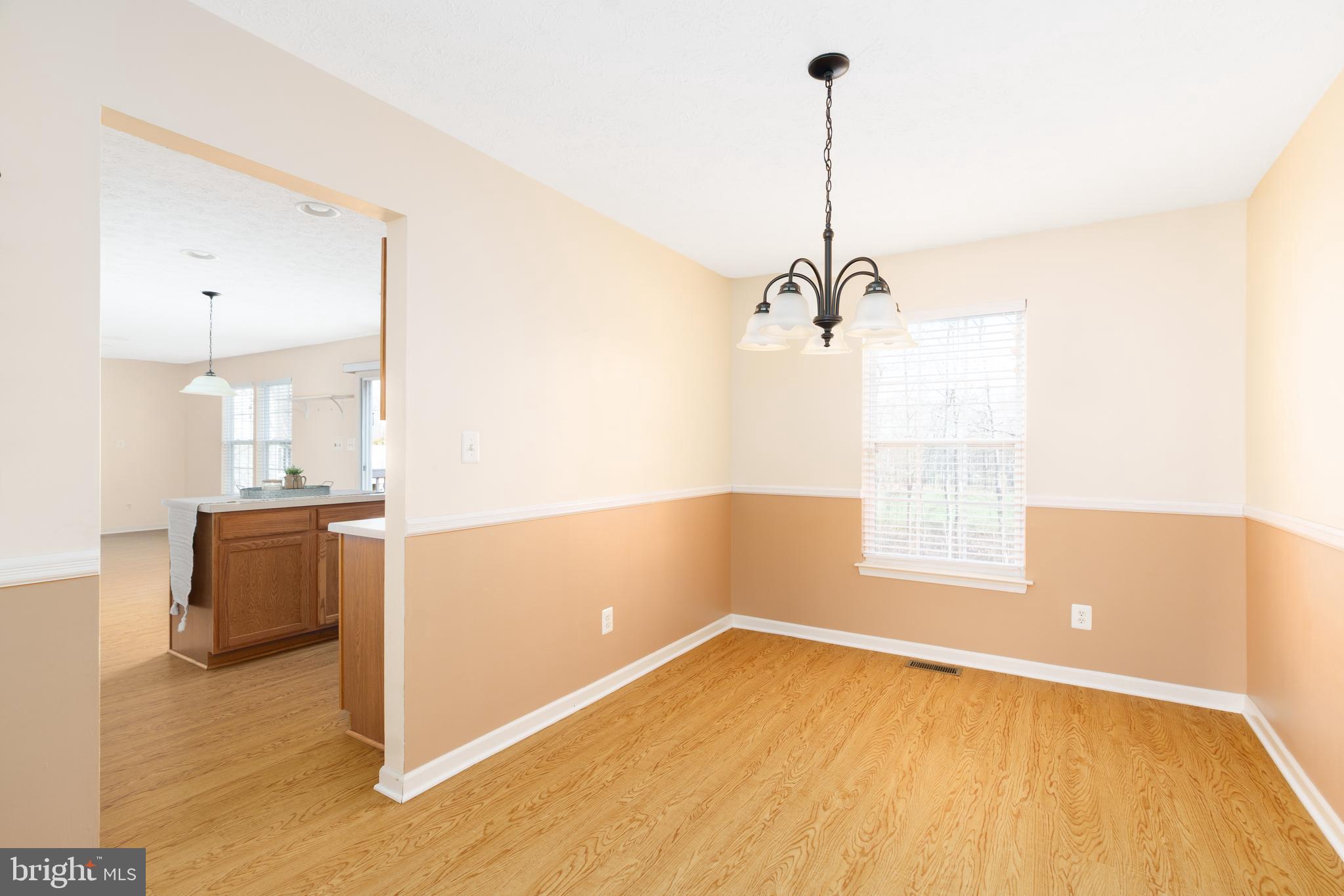 248 Patriots Way Elkton, MD 21921 - Photo 5 of 40 a view of a room with wooden floor and windows