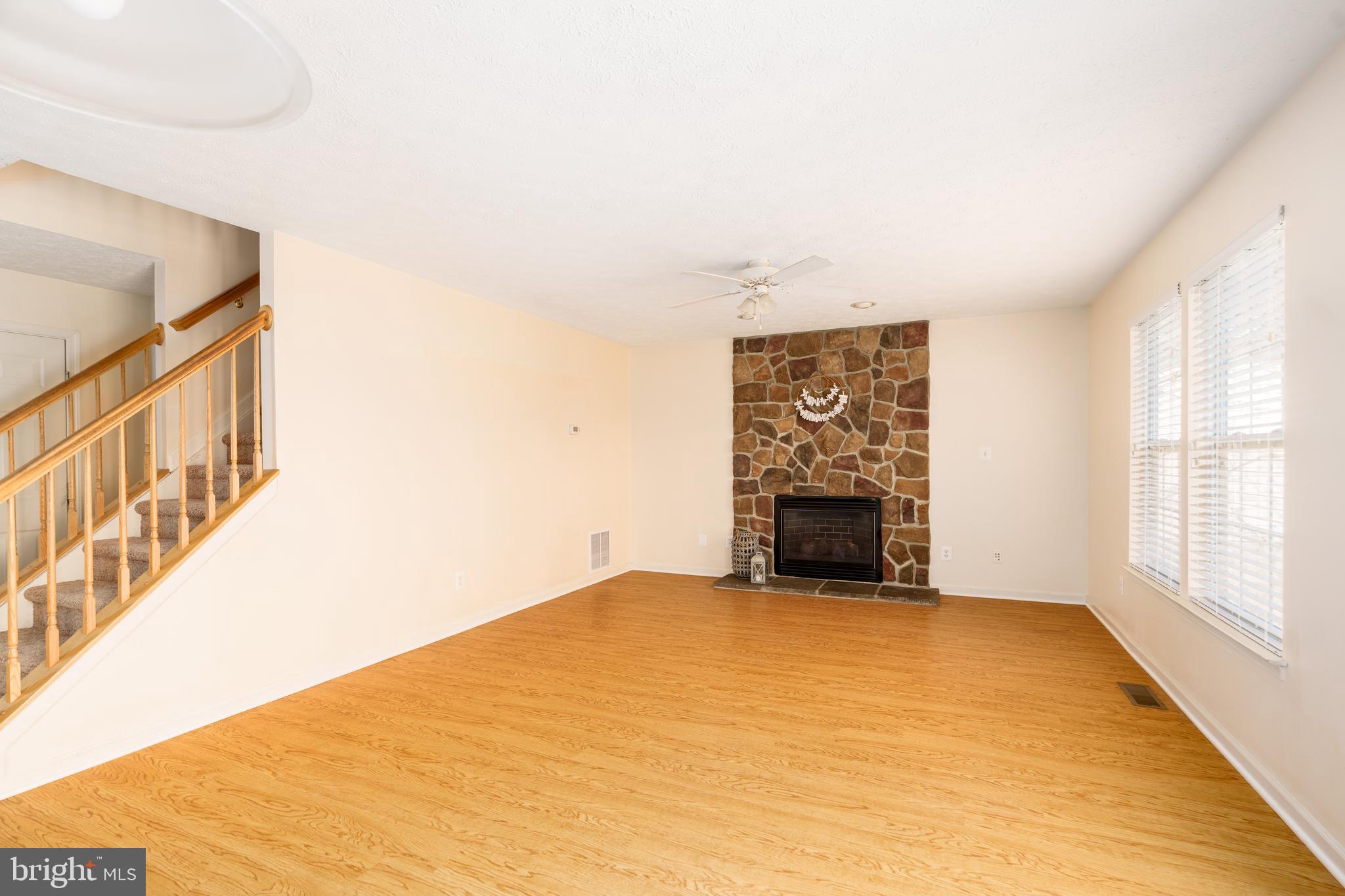 248 Patriots Way Elkton, MD 21921 - Photo 9 of 40 a view of an empty room with a fireplace and a window
