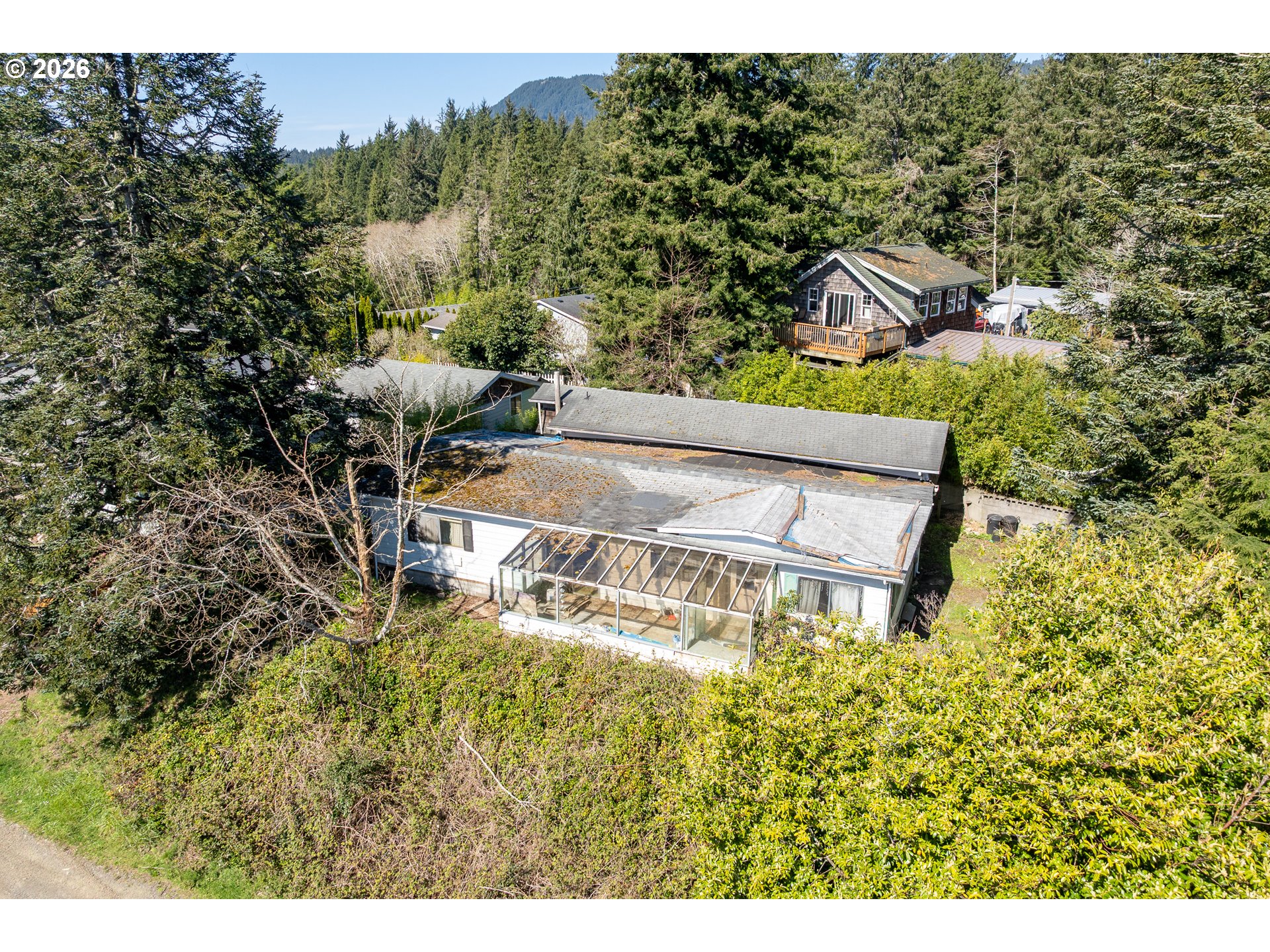 12850 Hayes Drive Nehalem, OR 97131 - Photo 9 of 9 a view of a swimming pool with a yard
