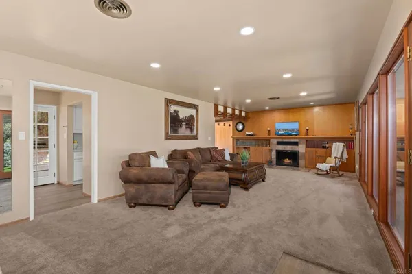 a spacious bathroom with a tub sink and mirror