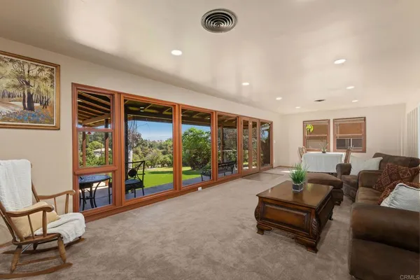a kitchen with stainless steel appliances granite countertop a refrigerator and a stove