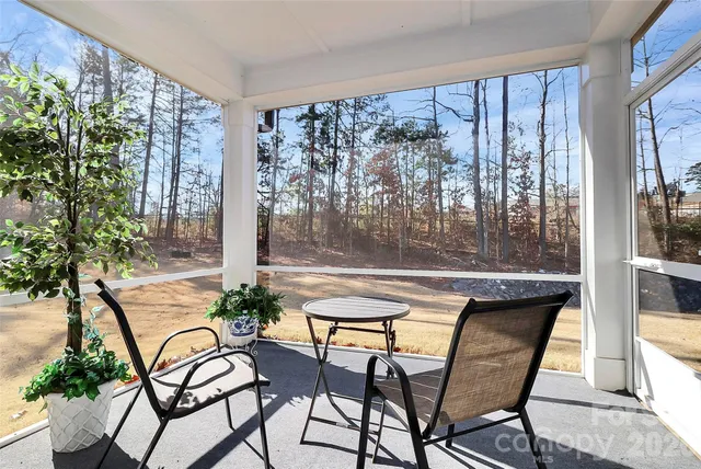 a view of a swimming pool with outdoor seating