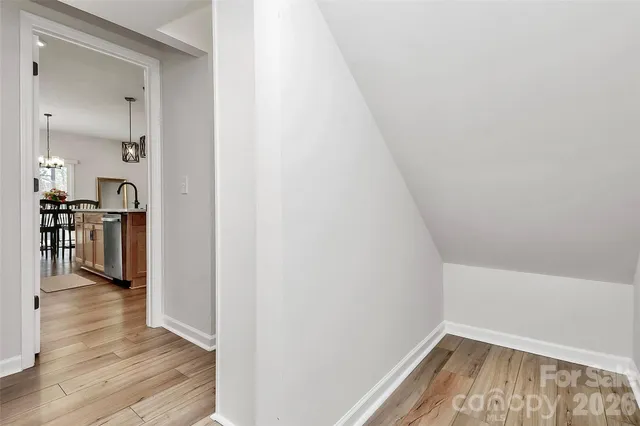 a view of a hardwood floor in a room