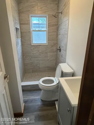 a white toilet sitting next to a bath tub