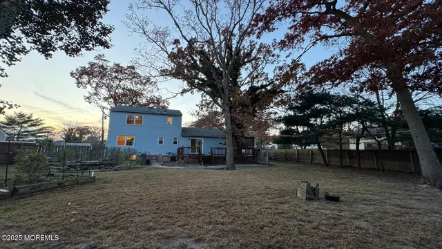 a backyard of a house with lots of trees