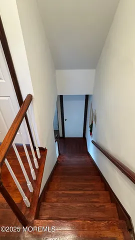 a view of an entryway with wooden floor
