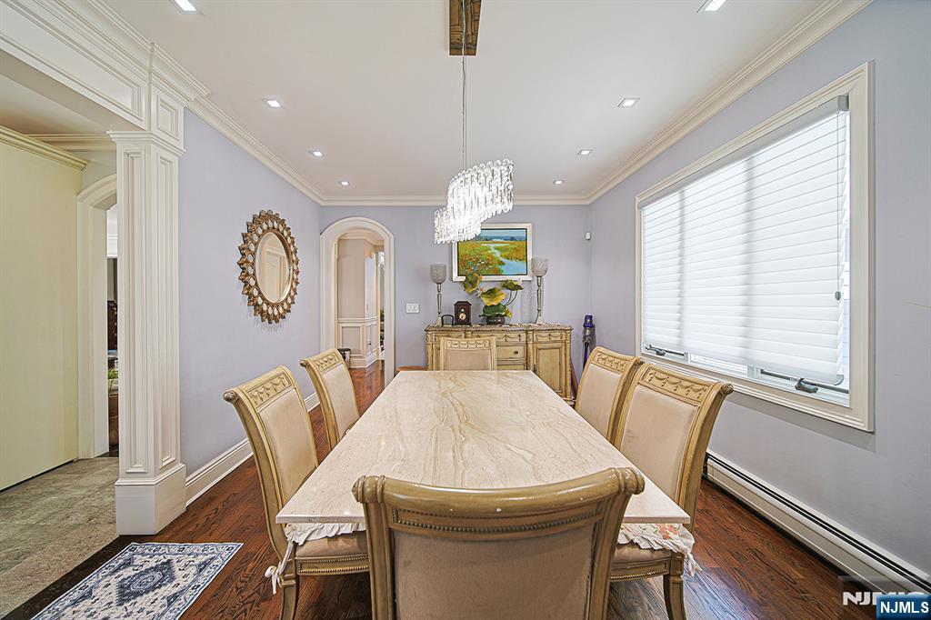 897 Virgil Avenue Ridgefield, NJ 07657 - Photo 24 of 50 a view of a dining room with furniture window and wooden floor