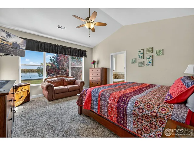 a bedroom with a bed and a couch