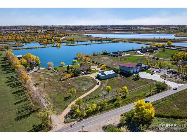 an aerial view of a residential houses with outdoor space