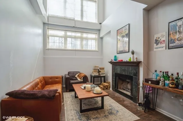 a living room with furniture and a fireplace