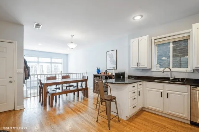 a kitchen with lots of counter top space and dining table
