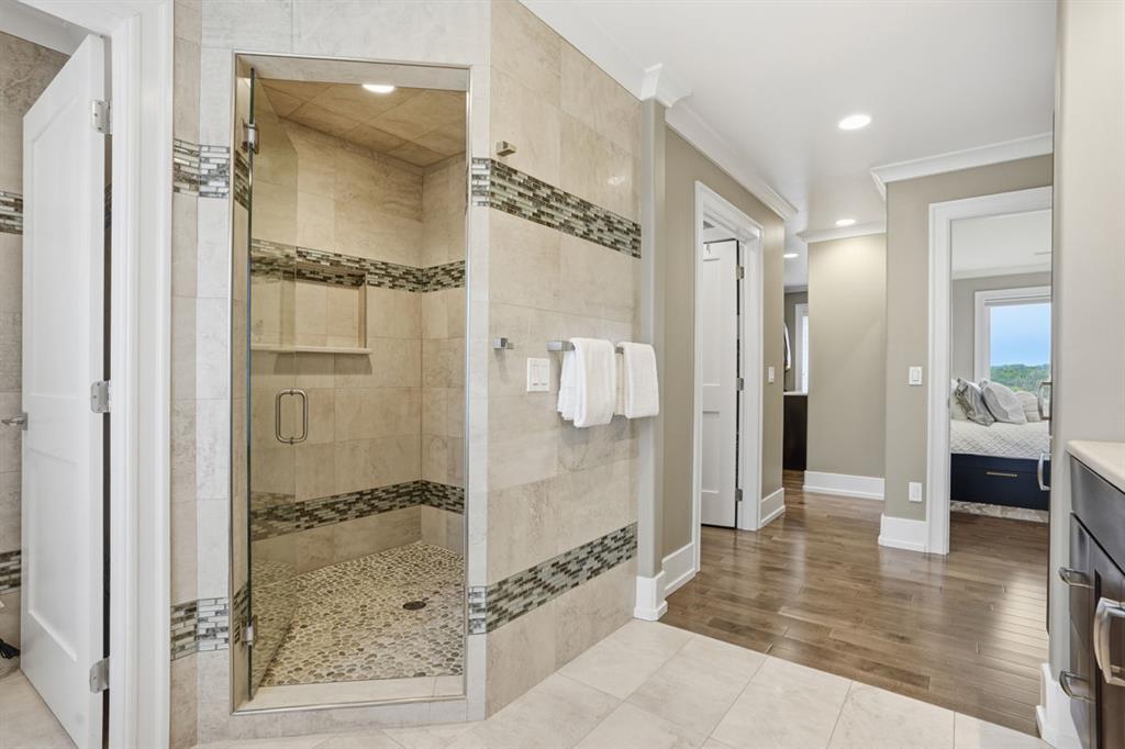 931 Pleasant Hill Road Wexford, PA 15090 - Photo 23 of 50 a bathroom with a glass shower door and a mirror
