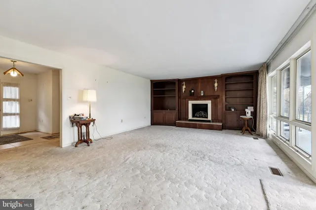 a view of a livingroom with furniture and a fireplace