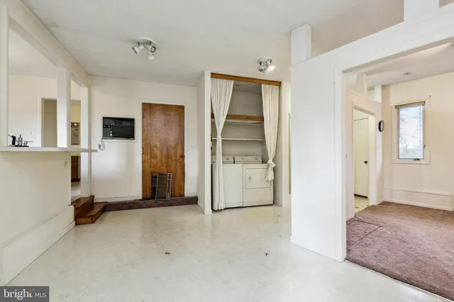 a kitchen with a refrigerator sink stove and cabinets