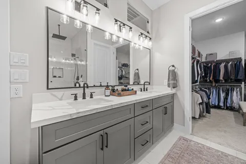 a bathroom with a double vanity sink and a mirror