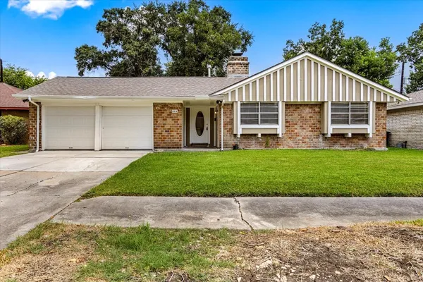 a front view of a house with a yard and porch