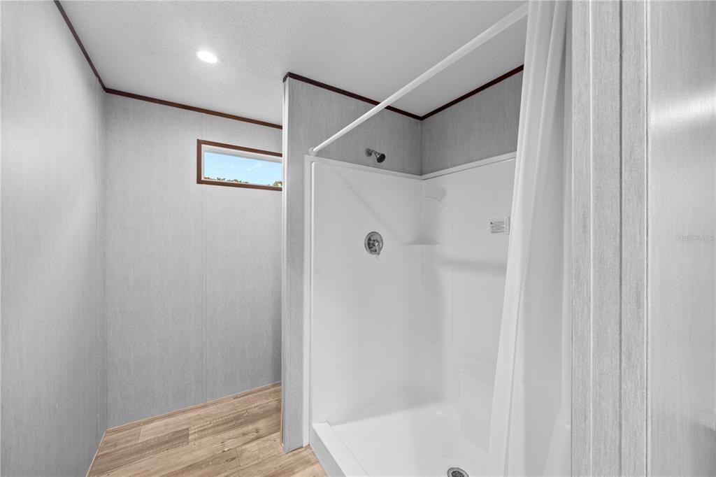 9160 Southwest 31st Avenue Road Ocala, FL 34476 - Photo 18 of 30 a bathroom with a shower and a tub