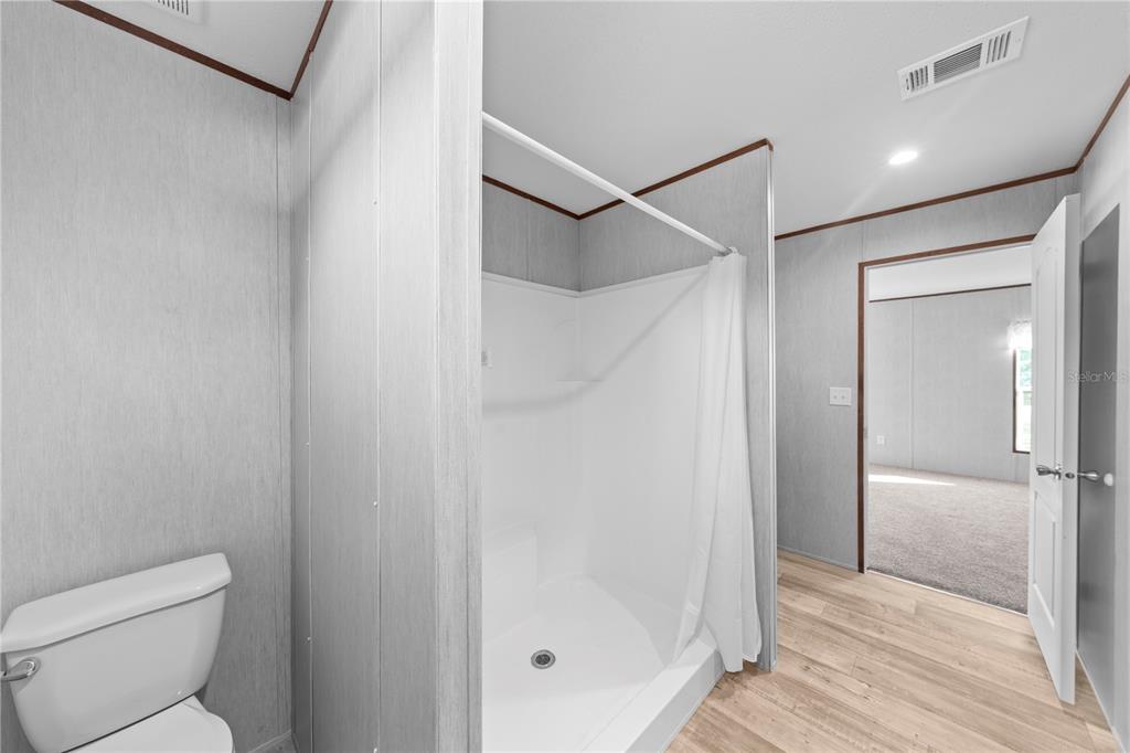 9160 Southwest 31st Avenue Road Ocala, FL 34476 - Photo 19 of 30 a bathroom that has a glass shower door