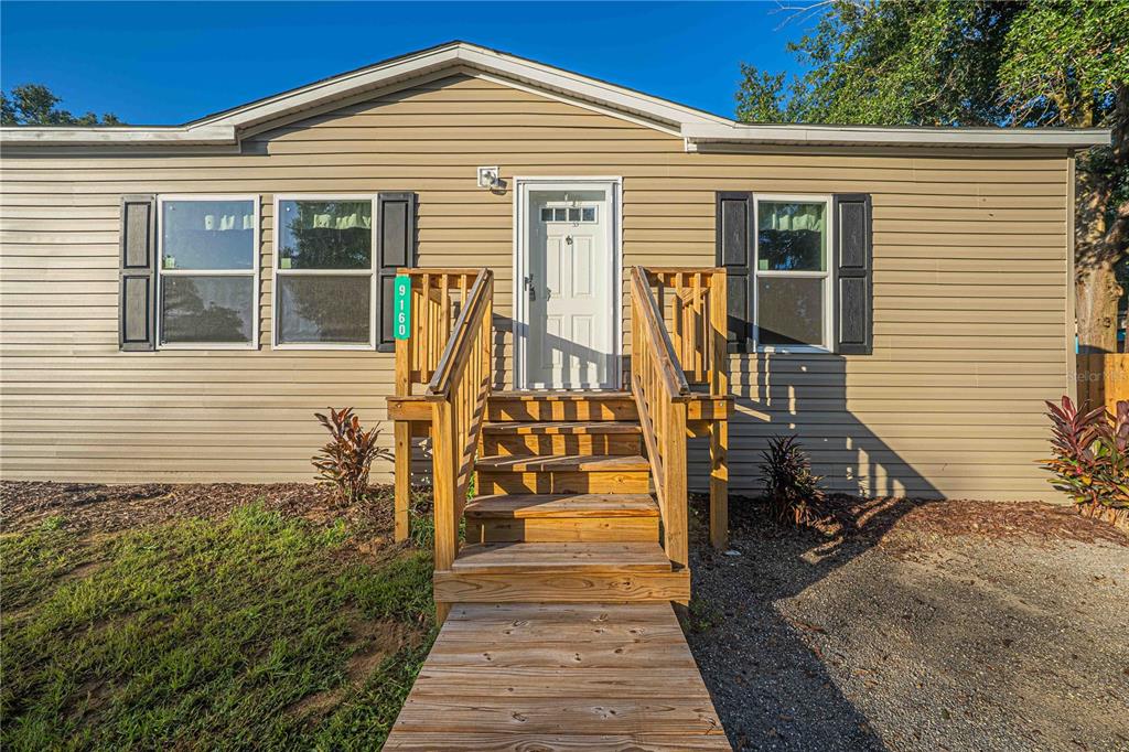 9160 Southwest 31st Avenue Road Ocala, FL 34476 - Photo 2 of 30 a front view of a house with a yard