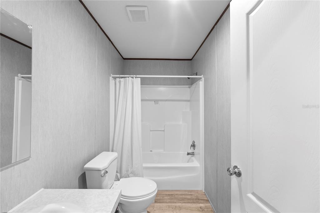 9160 Southwest 31st Avenue Road Ocala, FL 34476 - Photo 23 of 30 a bathroom with a toilet and a shower