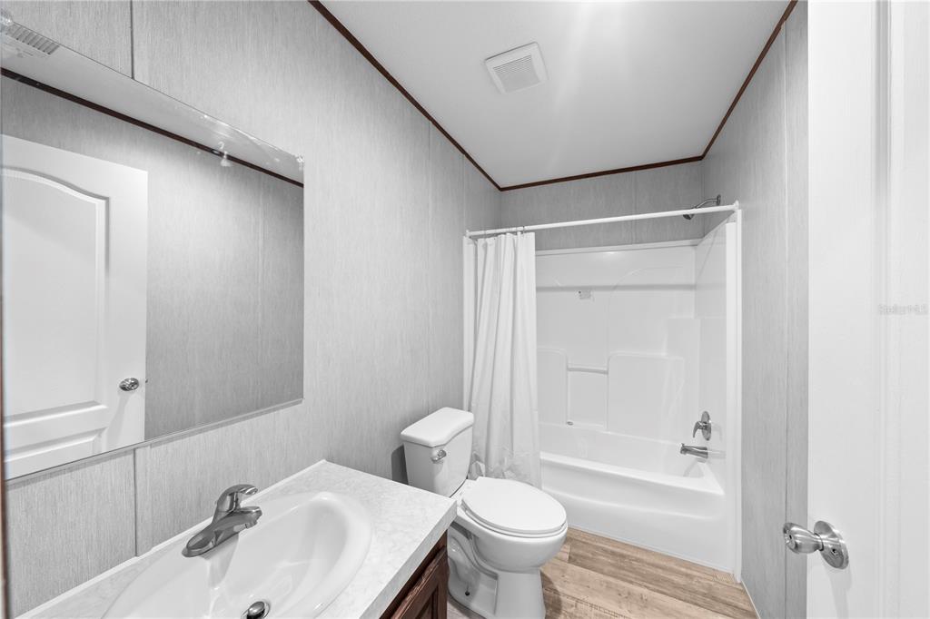 9160 Southwest 31st Avenue Road Ocala, FL 34476 - Photo 27 of 30 a bathroom with a sink toilet and shower