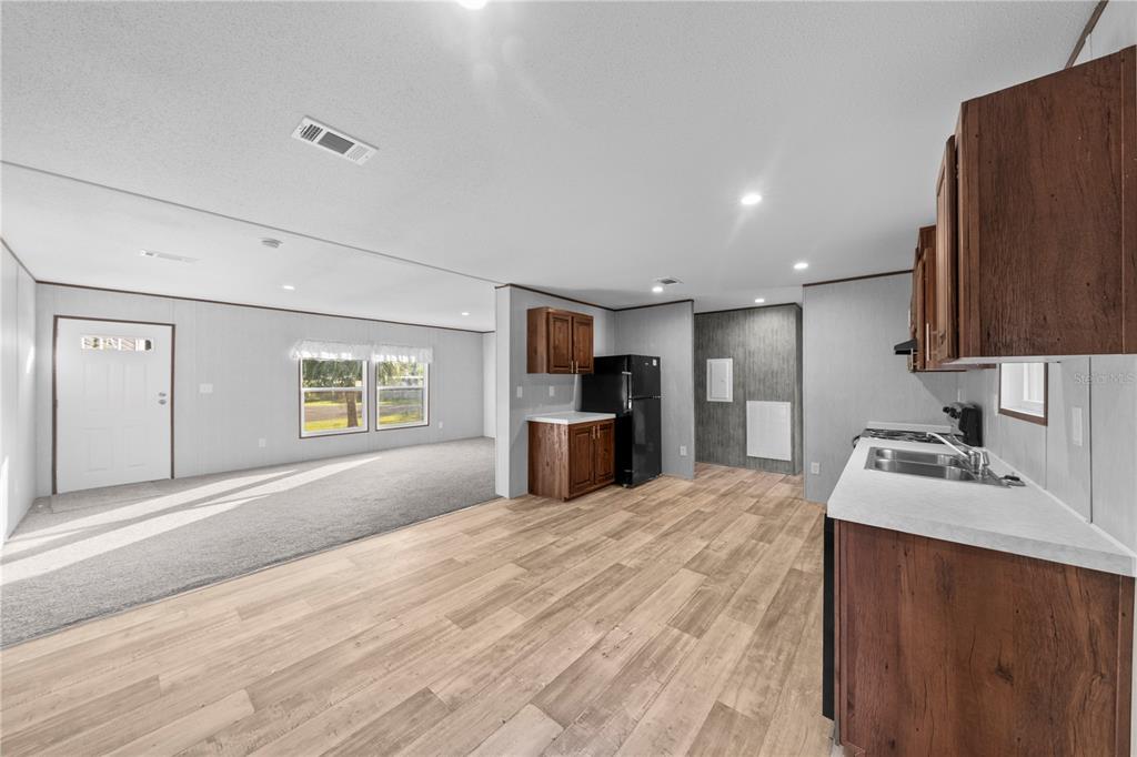 9160 Southwest 31st Avenue Road Ocala, FL 34476 - Photo 10 of 30 a kitchen with stainless steel appliances granite countertop a refrigerator sink and stove