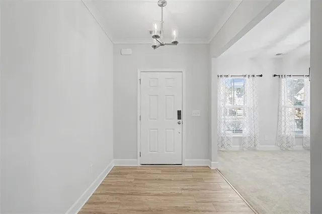 a view of a hallway with wooden shelves