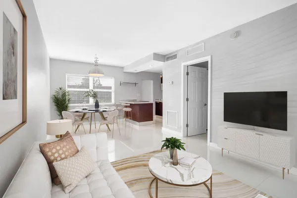 a living room with furniture a flat screen tv and a large window