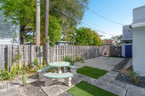 a view of a chair in backyard of the house