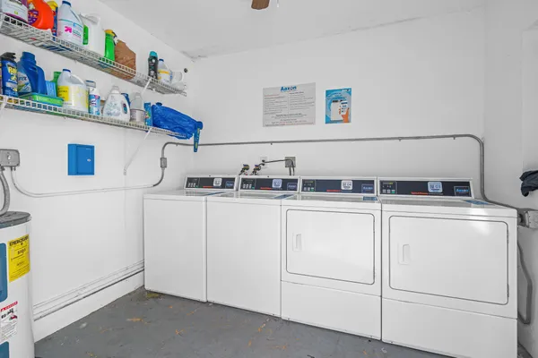 a kitchen with cabinets and white appliances