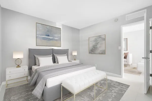 a bedroom with a bed and a painting on the wall