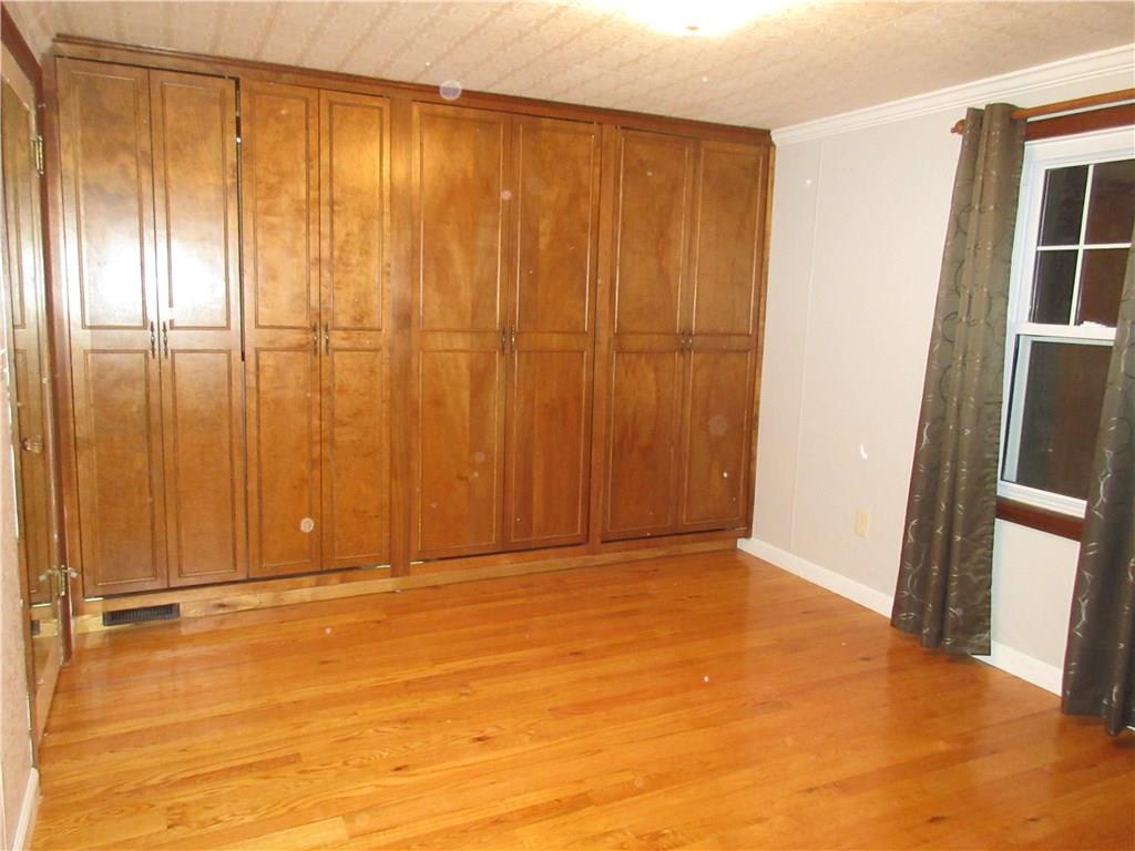 108 North Pike Road Sarver, PA 16055 - Photo 14 of 25 Second bedroom has a wall of closet space.