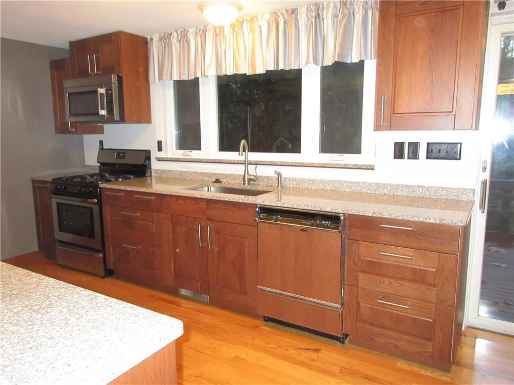108 North Pike Road Sarver, PA 16055 - Photo 5 of 25 New stainless steel gas stove and stainless steel microwave.