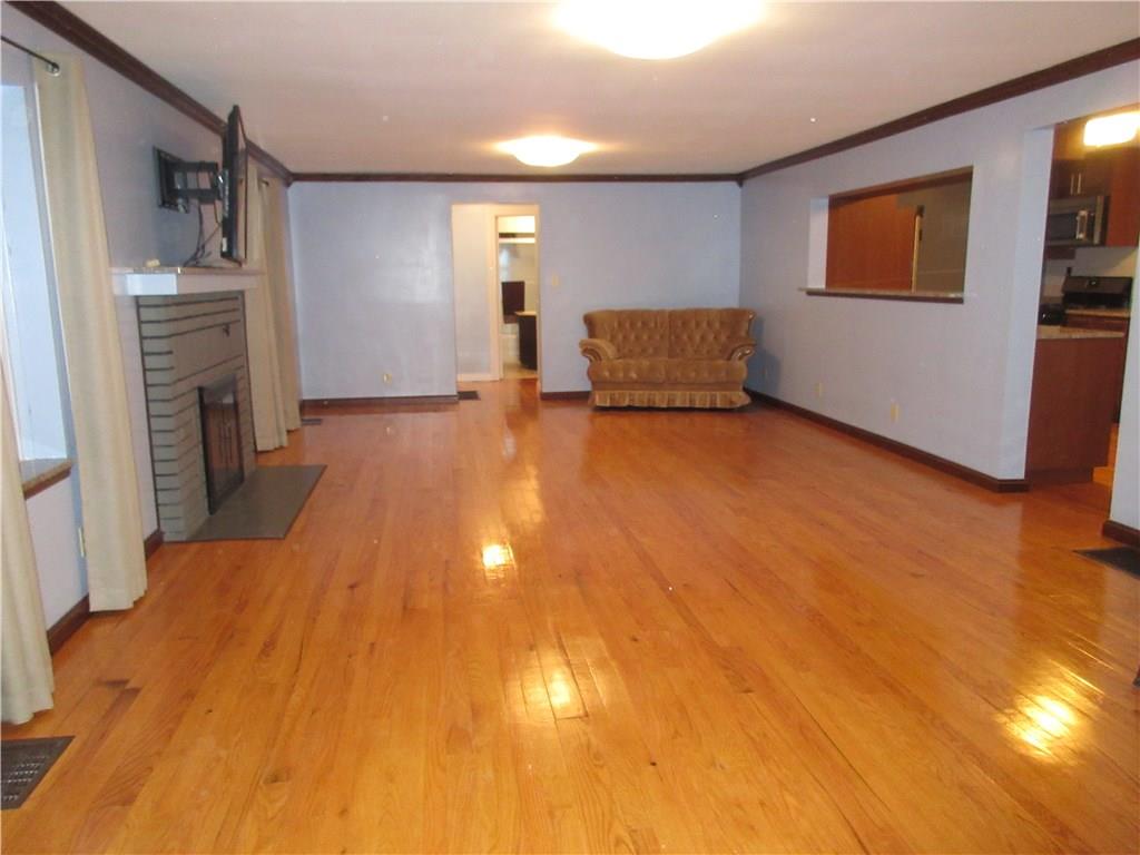 108 North Pike Road Sarver, PA 16055 - Photo 8 of 25 Crown molding and gleaming hardwood floors.