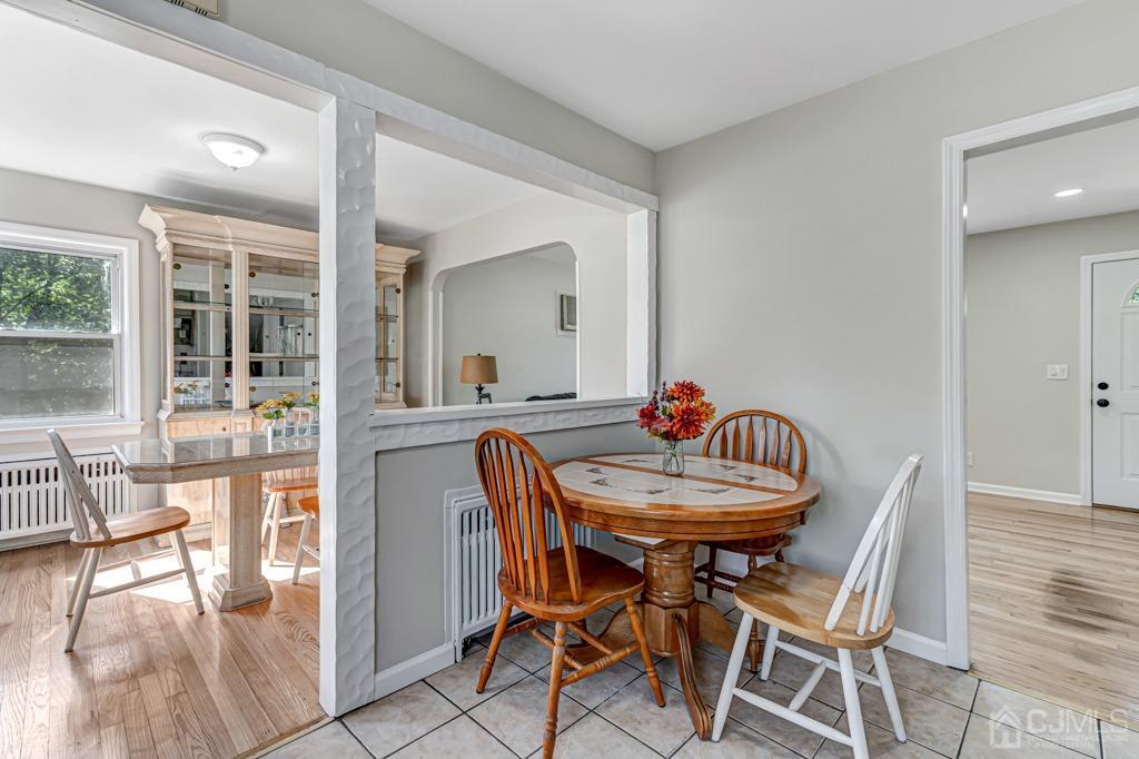 528 Melrose Avenue Middlesex, NJ 08846 - Photo 12 of 40 a dining room with furniture and wooden floor
