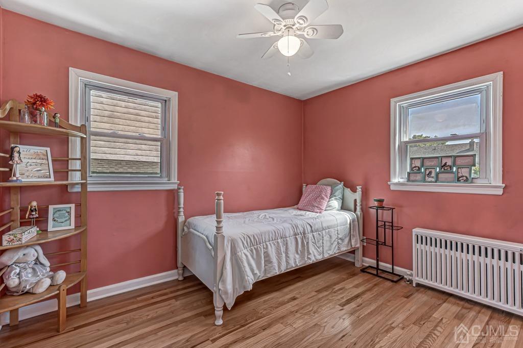 528 Melrose Avenue Middlesex, NJ 08846 - Photo 14 of 40 a bedroom with a bed and wooden floor