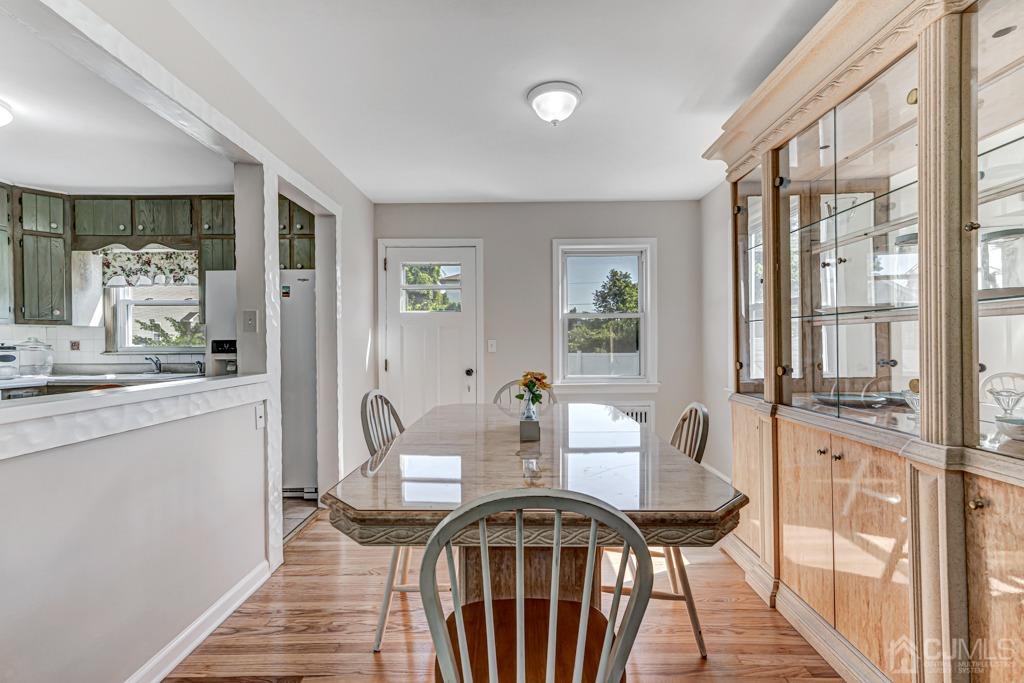 528 Melrose Avenue Middlesex, NJ 08846 - Photo 8 of 40 a view of a dining room with furniture and wooden floor