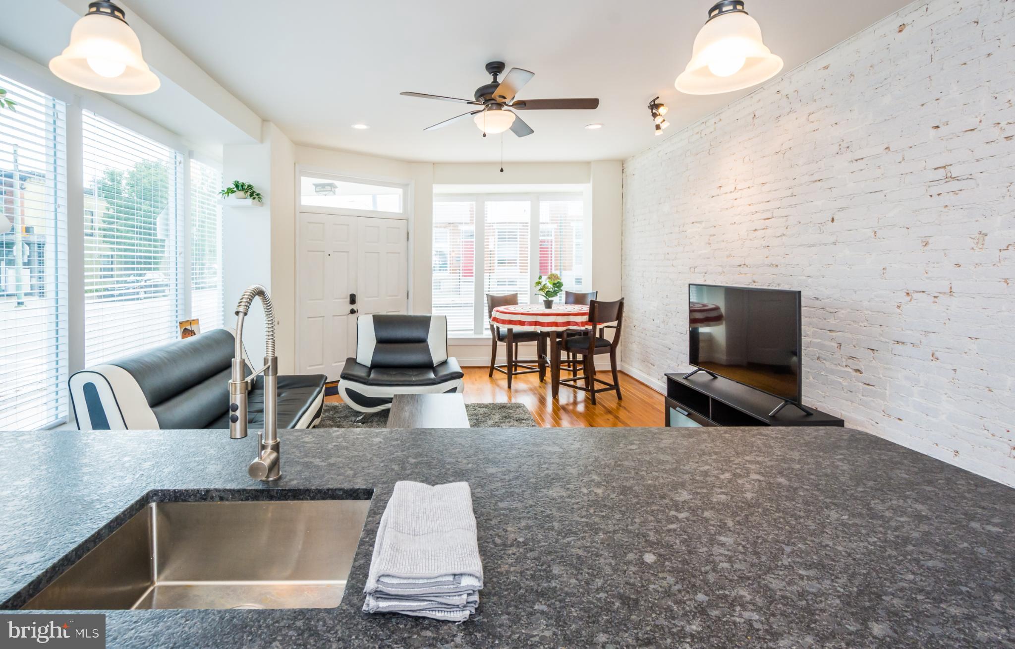 600 South Linwood Avenue, Unit A Baltimore, MD 21224 - Photo 11 of 33 a living room with furniture and a large window