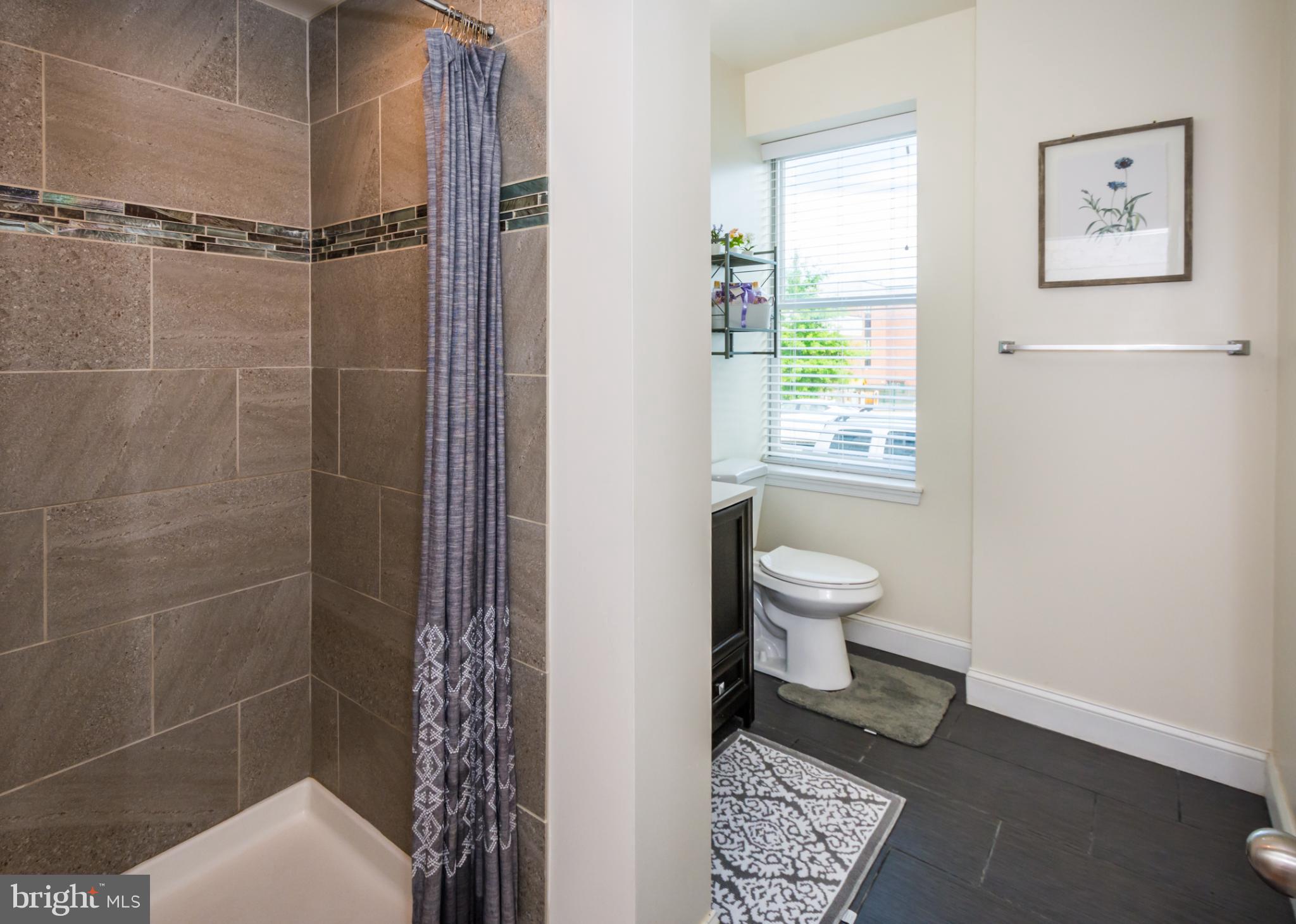 600 South Linwood Avenue, Unit A Baltimore, MD 21224 - Photo 13 of 33 a bathroom with a toilet and a shower